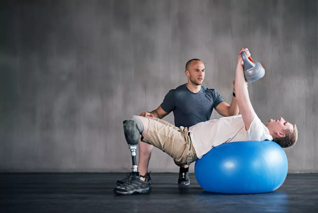 A disabled man and his personal trainer doing exercise