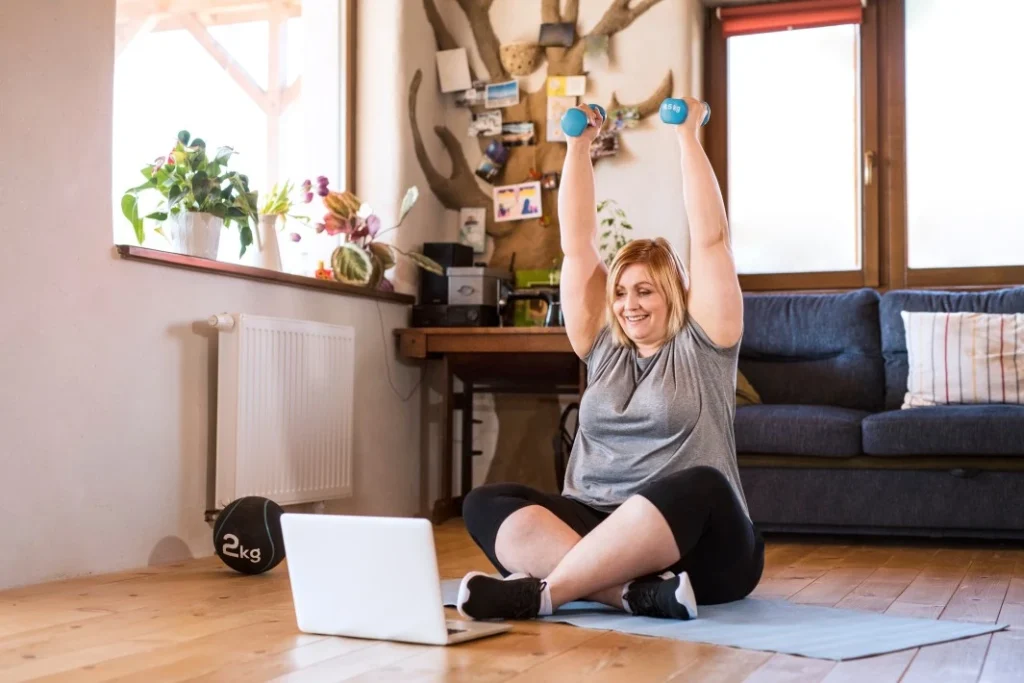A woman doing online training in her living room